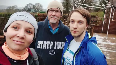 Andrea Watkins Pérez, 2021 Rory (right) with their dad and partner