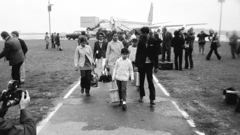 Getty Images Ugandan Asians arriving at Stansted Airport, 1972