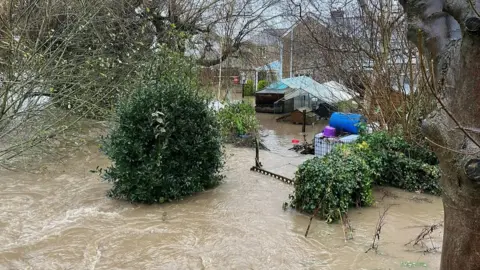 BBC A photo of a flooded garden