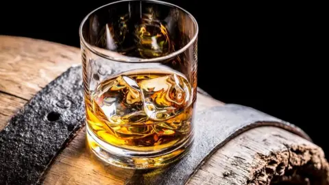 Getty Images whisky glass on barrel