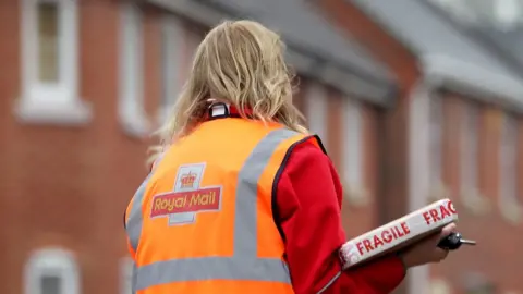 PA Media Royal Mail worker