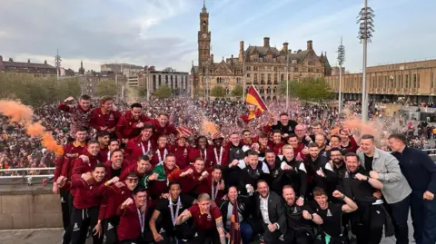 Bradford City players celebrating in front of fans in Centenary Square