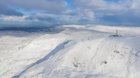 Nigel McFarland A mountain range with snow covering it.