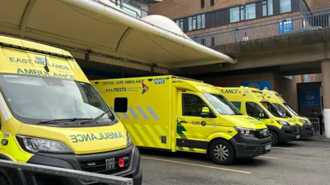 A line of four ambulances parked outside Nottingham's Queen's Medical Centre