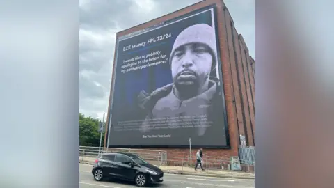 Zac Evans/ PA Media The billboard on Trafford Road in Manchester