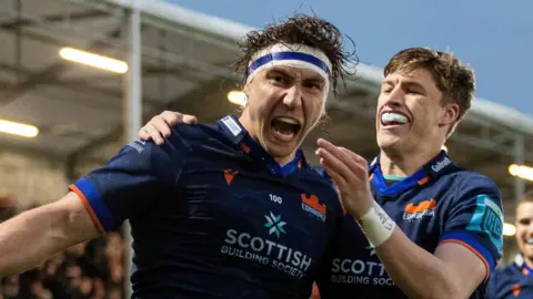 Jamie Ritchie celebrates a try