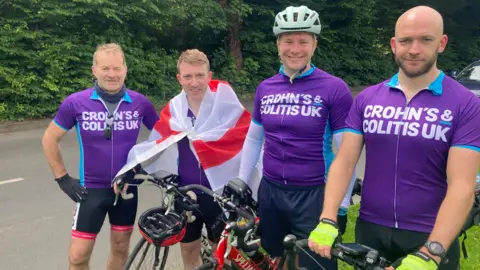 BBC/Piers Hopkirk Four cyclists smile at the camera