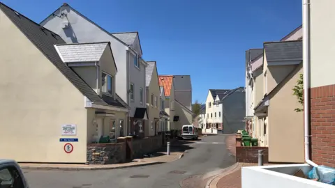 A photo looking up a housing estate in Rue Jamouneau, Guernsey.