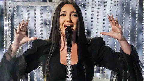 EPA Israel's Yuval Raphael performs the song 'New Day Will Rise' during the dress rehearsal for the second semi-final of the 69th Eurovision Song Contest (ESC) in Basel, Switzerland, 14 May 2025.