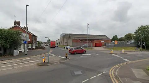 Google Streetview A mini roundabout junction with four approach roads