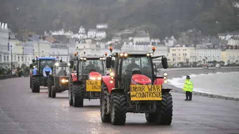 Getty Images Farmers driving connected  Llandudno promenade with a motion   connected  the beforehand   saying Labour War connected  Countryside