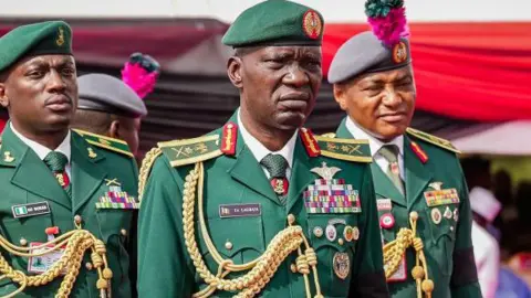 Getty Images Nigeria's Chief of Army General Taoreed Lagbaja wearing a green military suit with gold army regalia