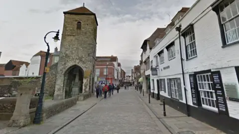 A street in in Canterbury showing a Victorian lamp-posts on the left 