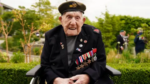 UK's oldest World War Two Veteran Donald Rose is pictured smiling and wearing his service medals