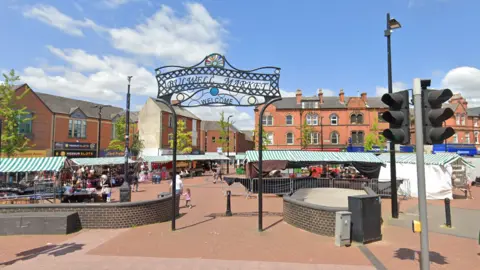 Google The sign for Bulwell Market, with stalls in the background