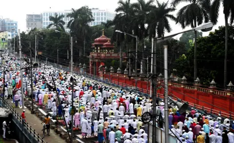 AFP Muslims walk down a street as part of a special prayer