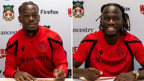 Wrexham's Jacques Ekomie (left) and Issa Kabore (right)