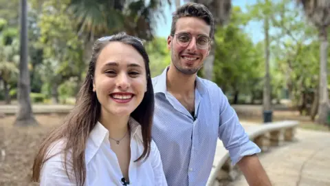 Maria Formosa and Christian Briffa sitting together