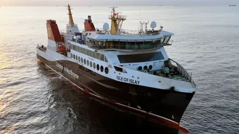 CMAL A black and white ship with red funnels and Isle of Islay written on the bow