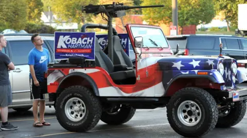 Getty Images His campaign vehicle bore a machinegun and a Trump doll on the bonnet