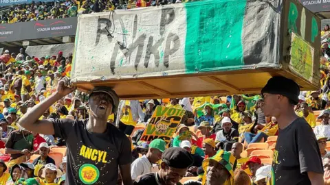 Nomsa Maseko/BBC ANC supporters carry the coffin