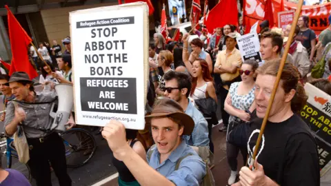 Getty Images A "Welcome Refugees" rally in Sydney on 29 September 2013