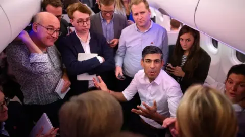 PA Media Rishi Sunak holds a press conference with political journalists on board a government plane as he heads to Bali in Indonesia for the G20 summit