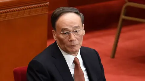 AFP/Getty Images Wang Qishan, a member of the Standing Committee of the Political Bureau of the Communist Party of China (CPC) Central Committee and secretary of the CPC Central Commission for Discipline Inspection (CCDI), attends the opening session of the Chinese People's Political Consultative Conference (CPPCC) at the Great Hall of the People in Beijing on 3 March 2015.