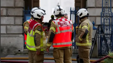 Reuters Firefighters work at the scene of a fire at Somerset House