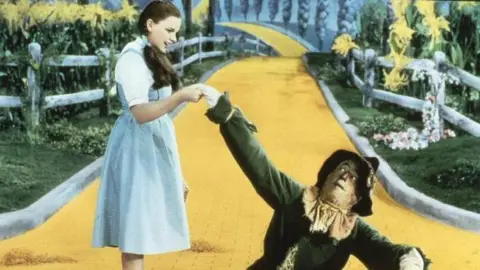 Film publicity material Still image of Judy Garland as Dorothy with the Scarecrow in the 1939 film the Wizard of Oz 