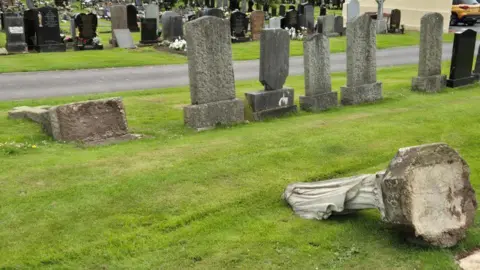 BBC Overturned gravestones in a cemetery 