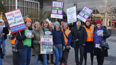 A picket line of social  workers outside Brighton and Hove City Council's offices