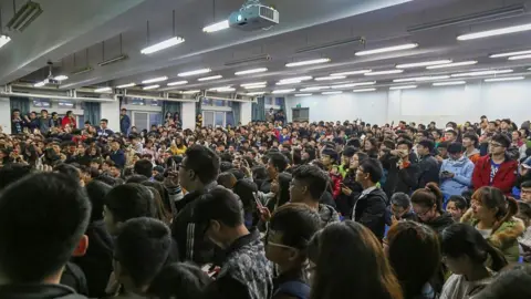 stringer/ Feature China/Future Publishing via Getty Images Students listen to a lecture by education influencer Zhang Xuefeng visiting Henan University of Technology in Zhengzhou