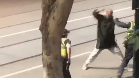 EPA A screenshot shows an incident in which a man armed with a knife attacked several people on Bourke Street