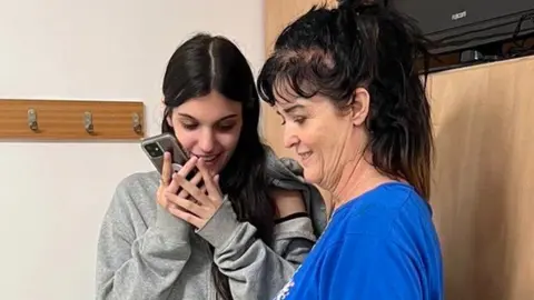 POTUS President Biden released a photo of Judith and Natalie Raanan speaking with the US leader on the phone after their release