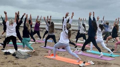 Paula McGuire - Beach yoga