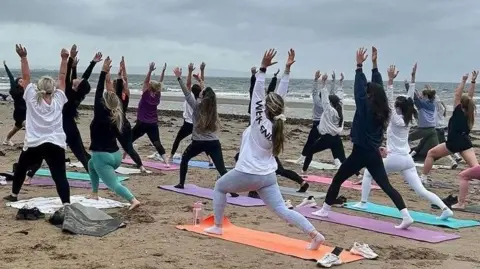 Paula McGuire  Paula McGuire - Beach yoga