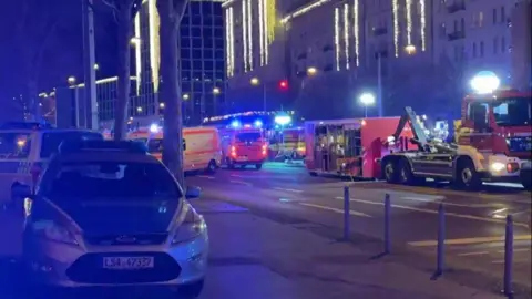 EBU Police and emergency services on a road with lights on