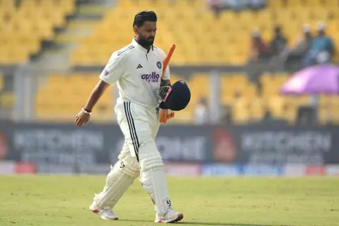 AFP via Getty Images India's Rishabh Pant walks back to the pavilion after his dismissal during the third day of the second Test cricket match between India and South Africa at the Barsapara Cricket Stadium in Guwahati on November 24, 2025. 