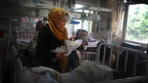 EPA rescued mother and her newborn baby receive medical care in a hospital a day after the complex attack at MSF (Doctors without Borders) hospital, in Kabul, Afghanistan,