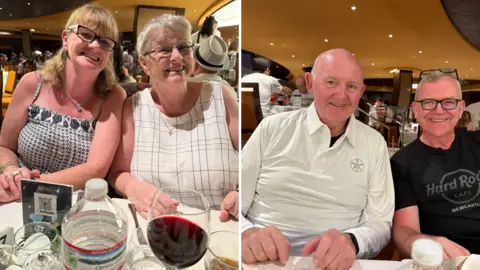 A group of four people sitting at a dinner table