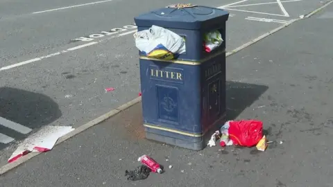 Bin overflowing with litter