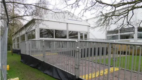 Pendery Architecture & Heritage Ltd A general view picture of a white temporary lecture theatre at St Catherine's College in Oxford.