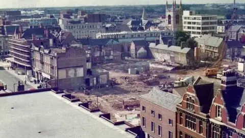 Chris Porsz An aerial view of the city centre with a large part missing where demolition has taken place to make way for a shopping centre.