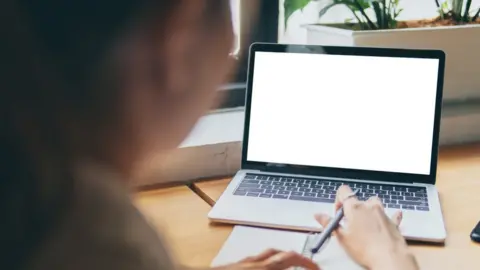 Getty Images Woman with laptop