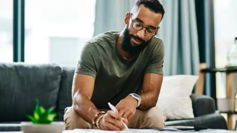 Getty Images Man works on finances