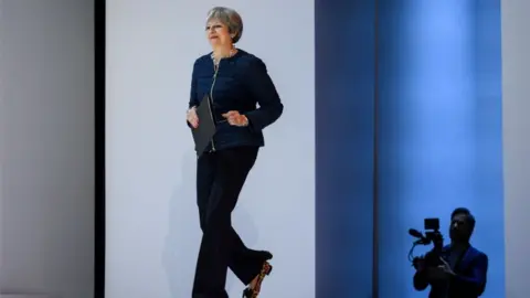 Getty Images Theresa May walks onto the stage at Davos