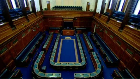 Empty Stormont debating chamber