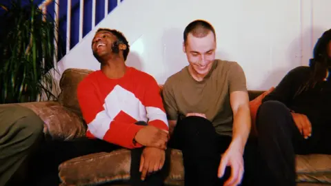 SLEEC Four people sitting on a sofa