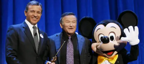 Getty Images Robin Williams with Disney CEO Bob Iger and Mickey Mouse